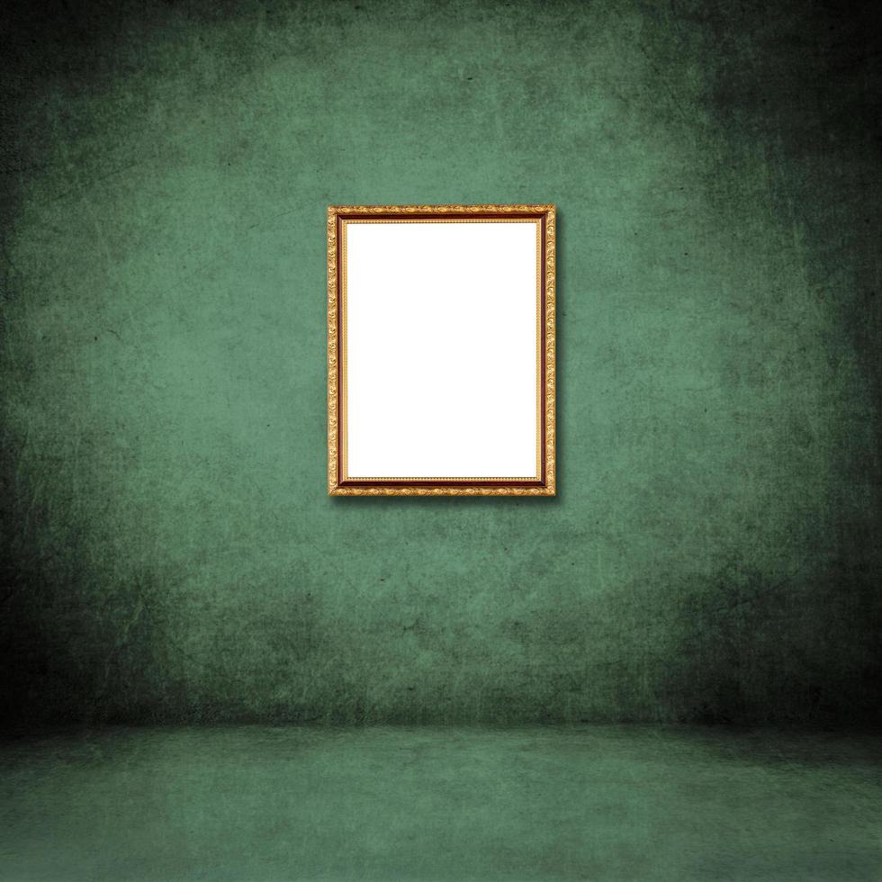 frame of photo on green grunge wall inside the room.