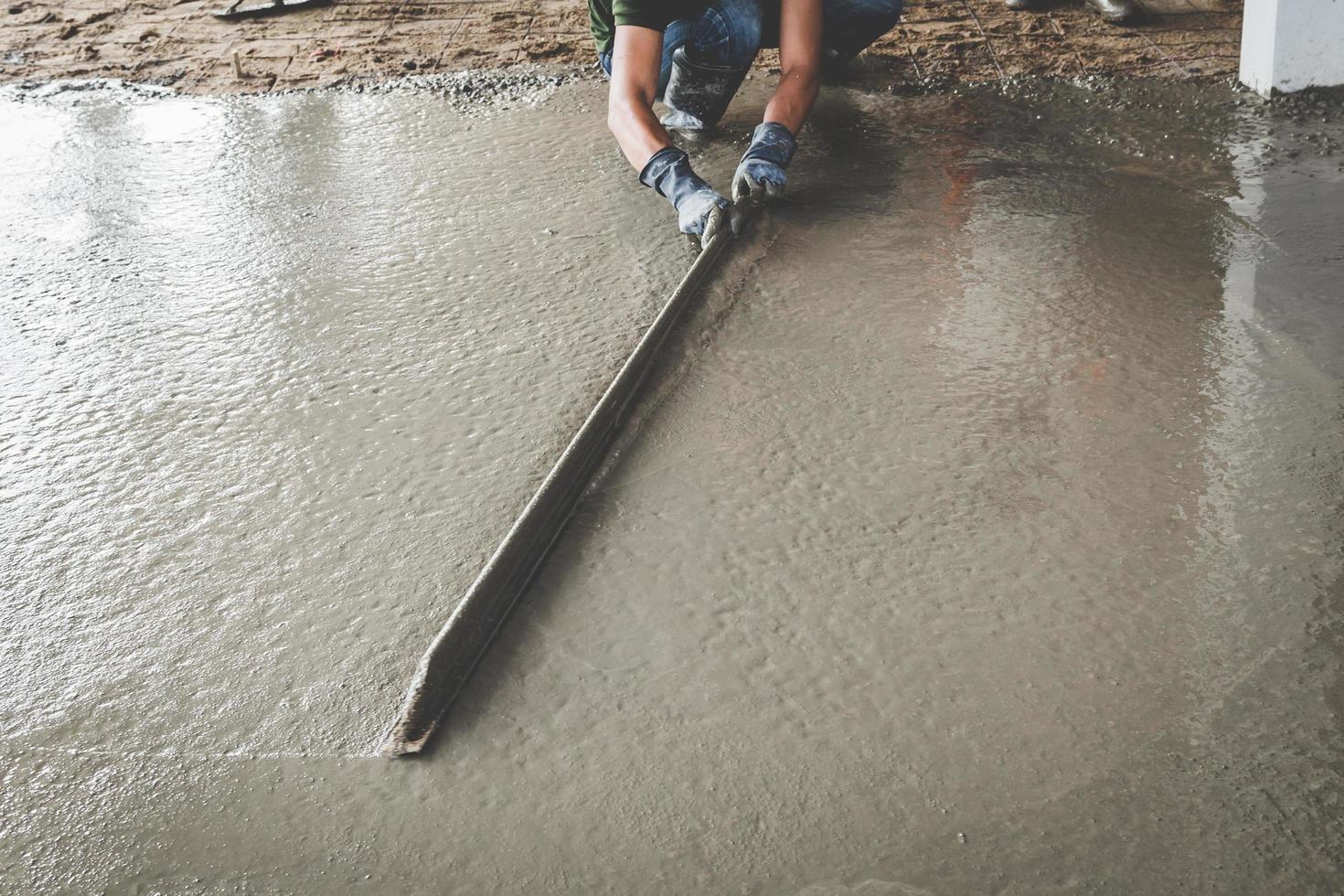 Mason building a screed coat cement photo