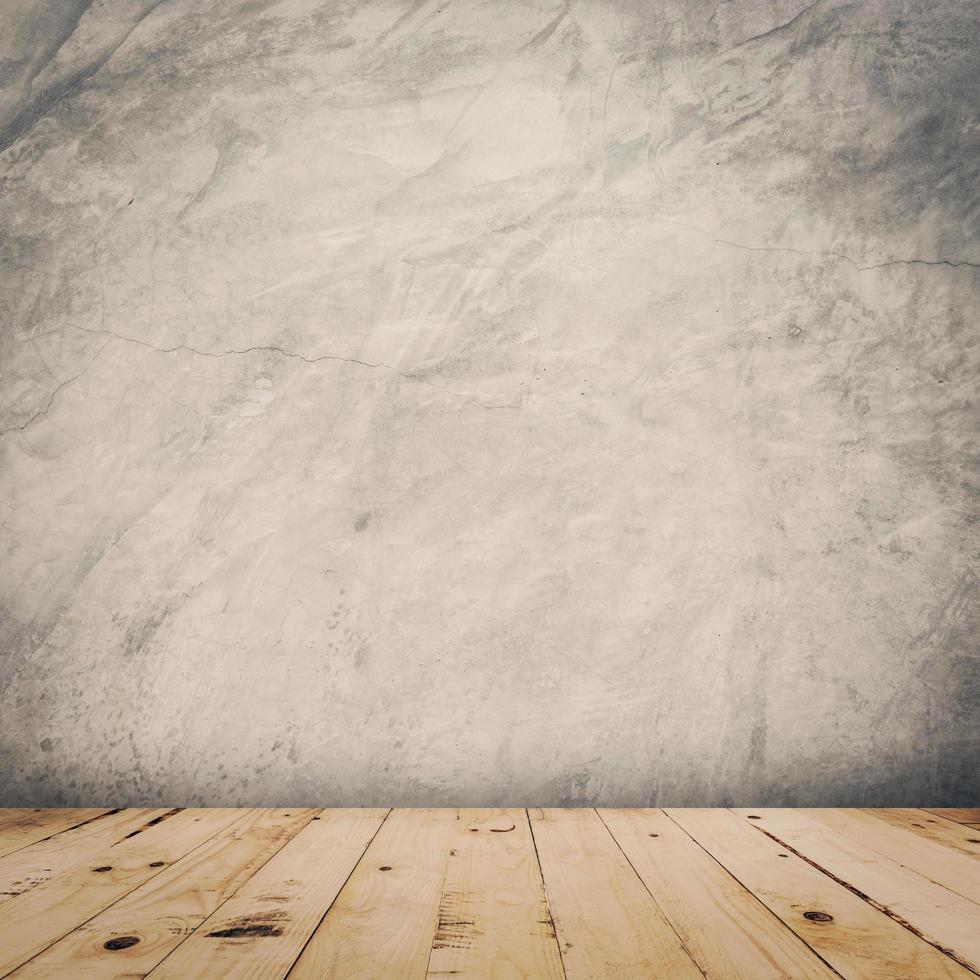 grunge cement wall and wood floor background and texture with space. photo