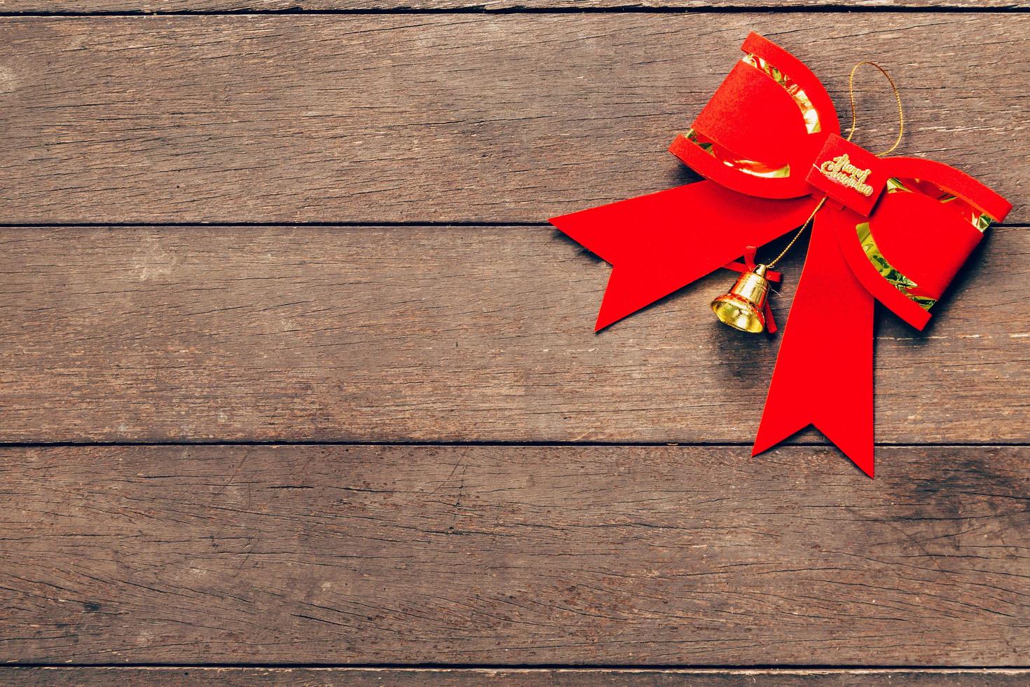 Red bow christmas on wood background with copyspace. photo