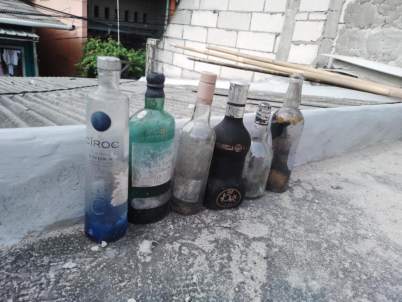 Recyclable packaging materials of bottled glass transparent. Many glass bottles separate and prepared for recycling. Concept of responsible, care, and saving the world. photo