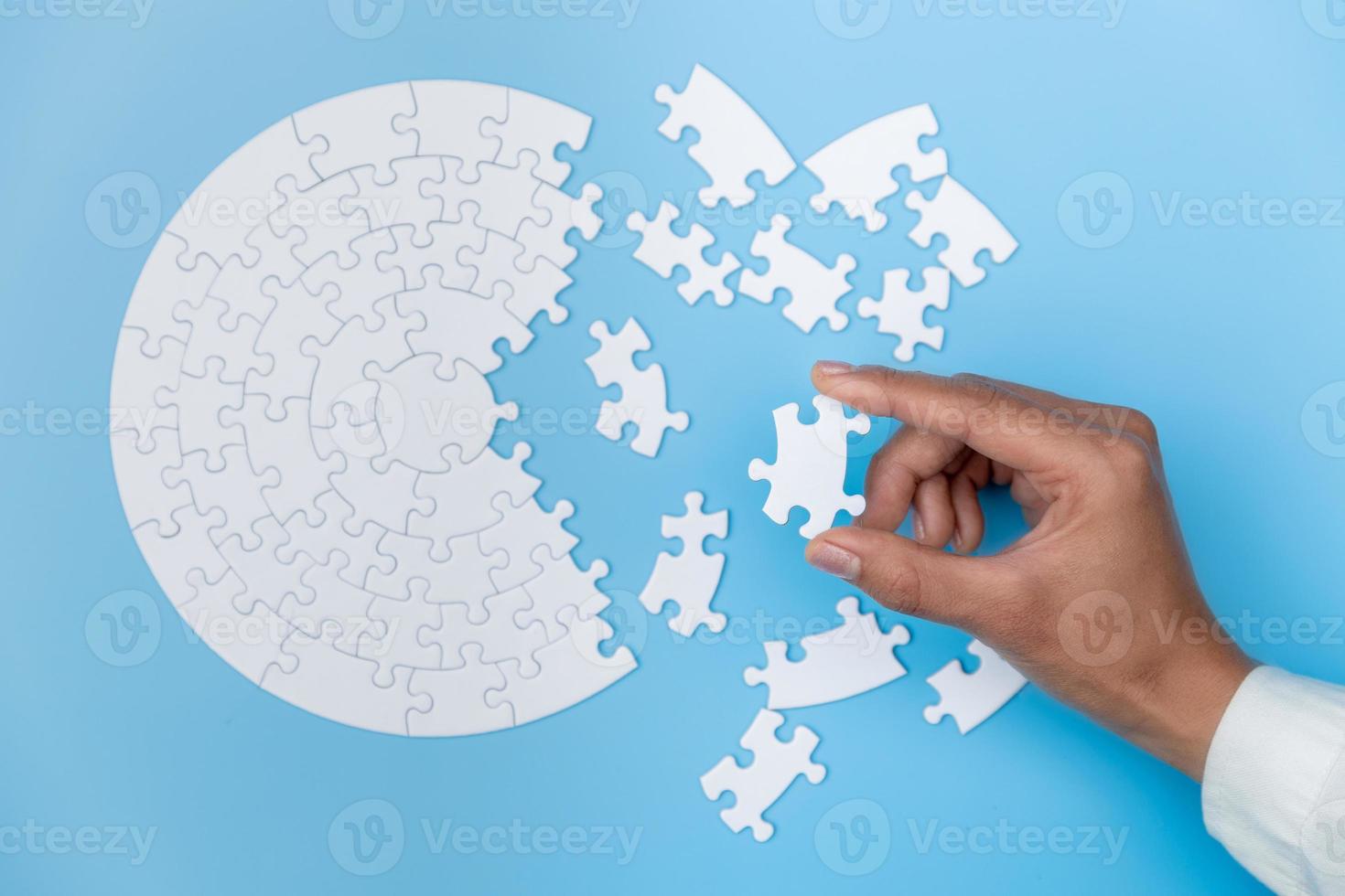 Pieces of jigsaw puzzle in man's hands, Business solutions, success and strategy concept. photo