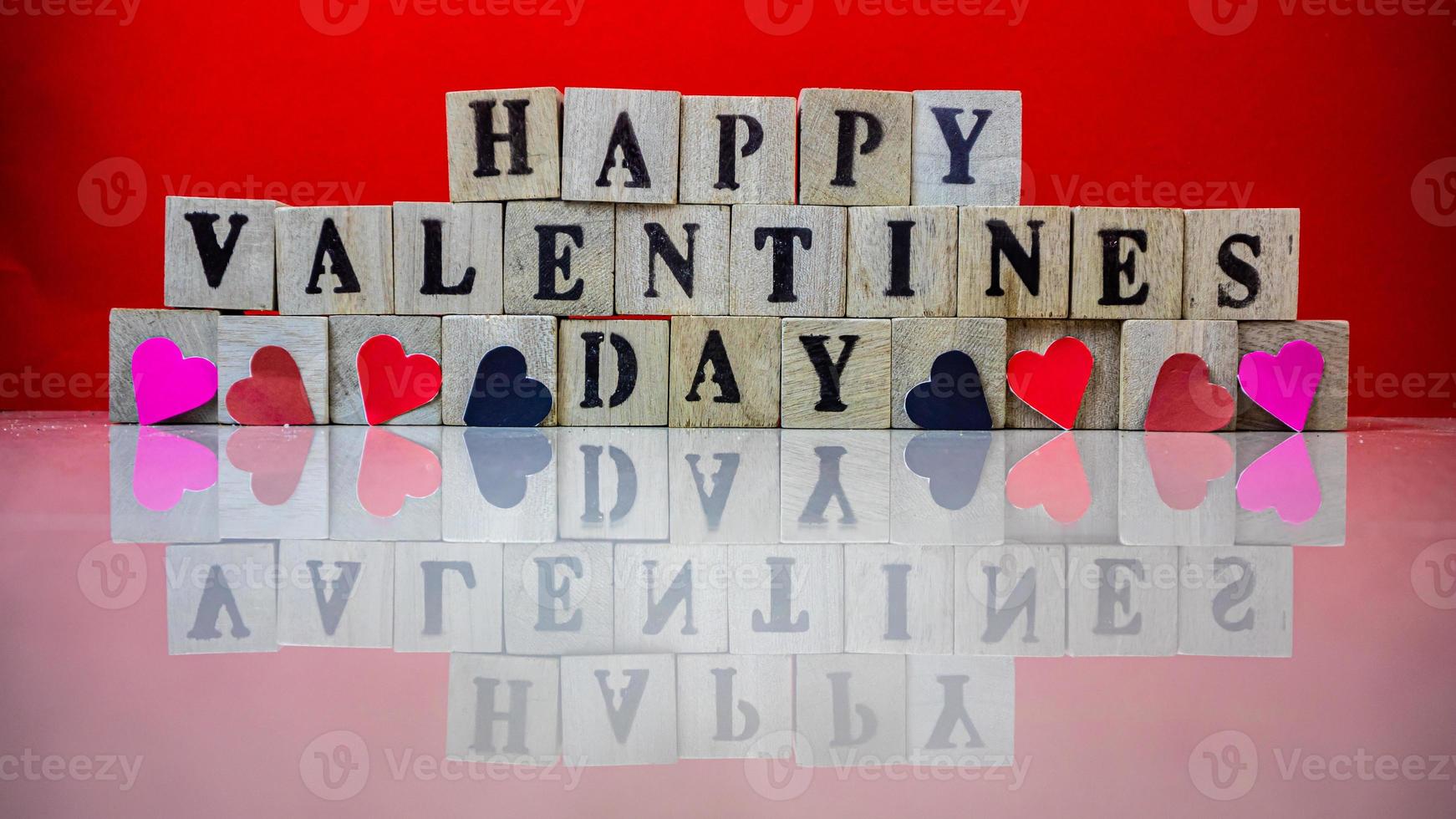 Happy valentine day on wooden blocks photo