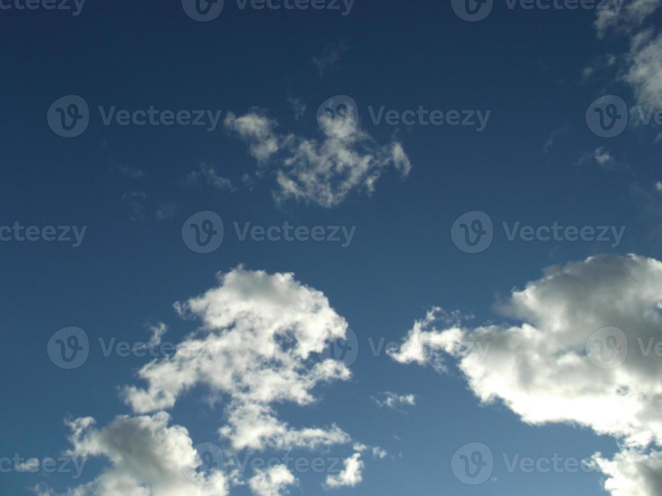 Blue sky and white fluffy clouds. photo