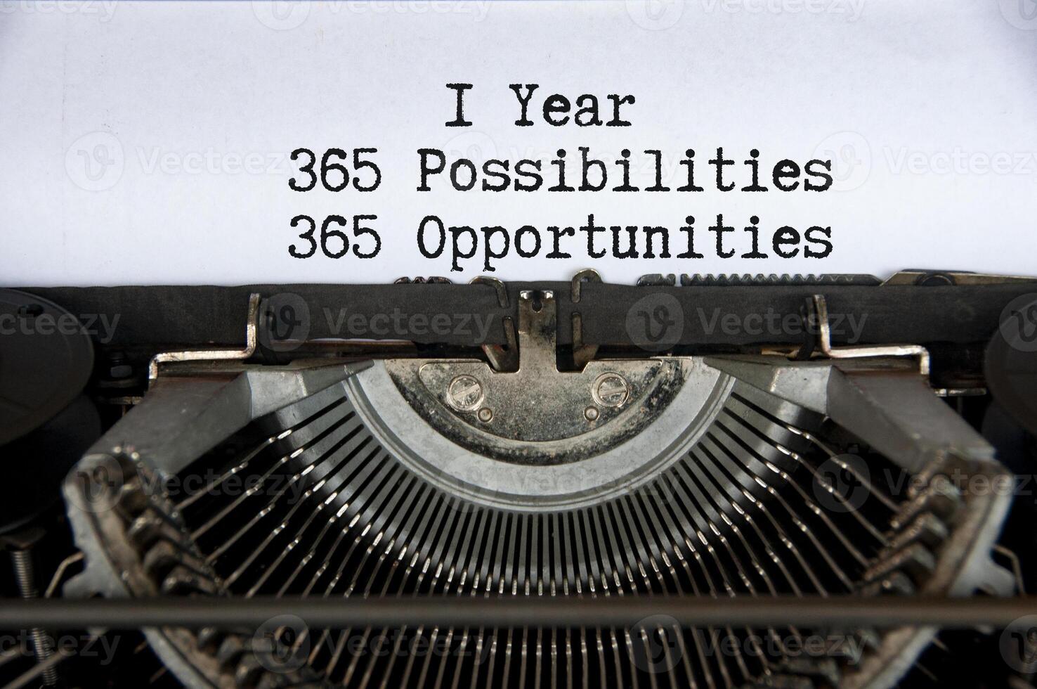 1 year 365 opportunities and opportunities words typed on an old vintage typewriter in black and white photo