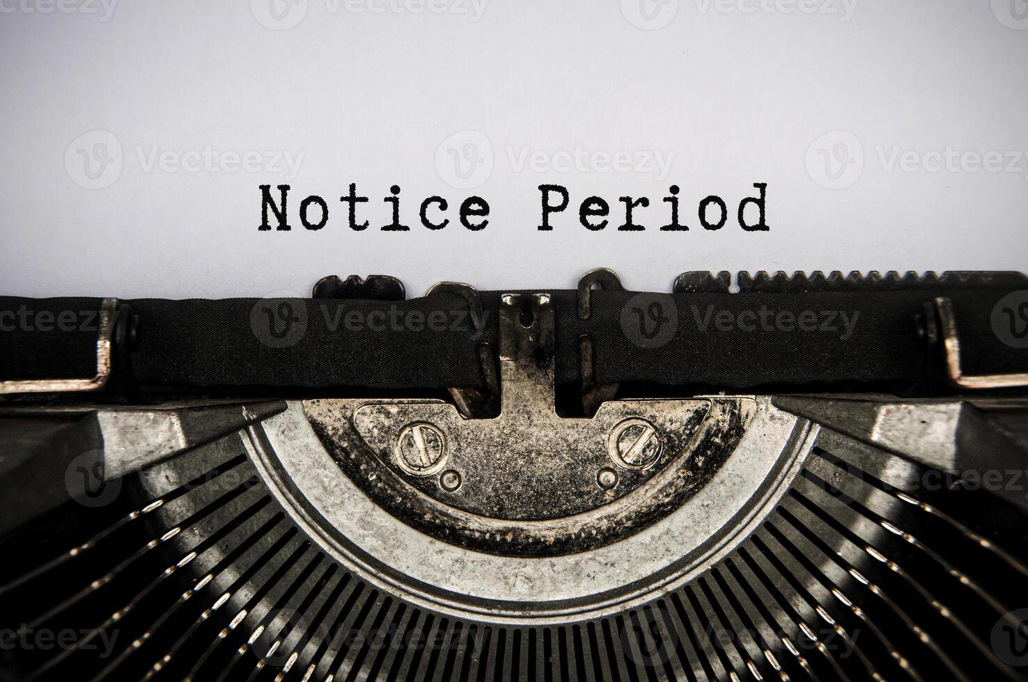 Notice period text typed on an old vintage typewriter. Employment and termination concept photo