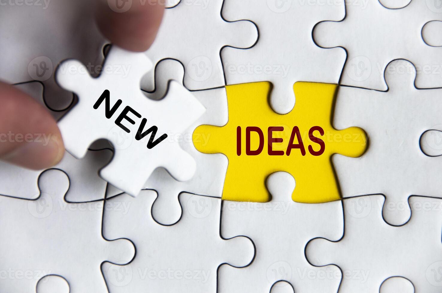 New ideas text on missing jigsaw puzzle. Business idea concept photo