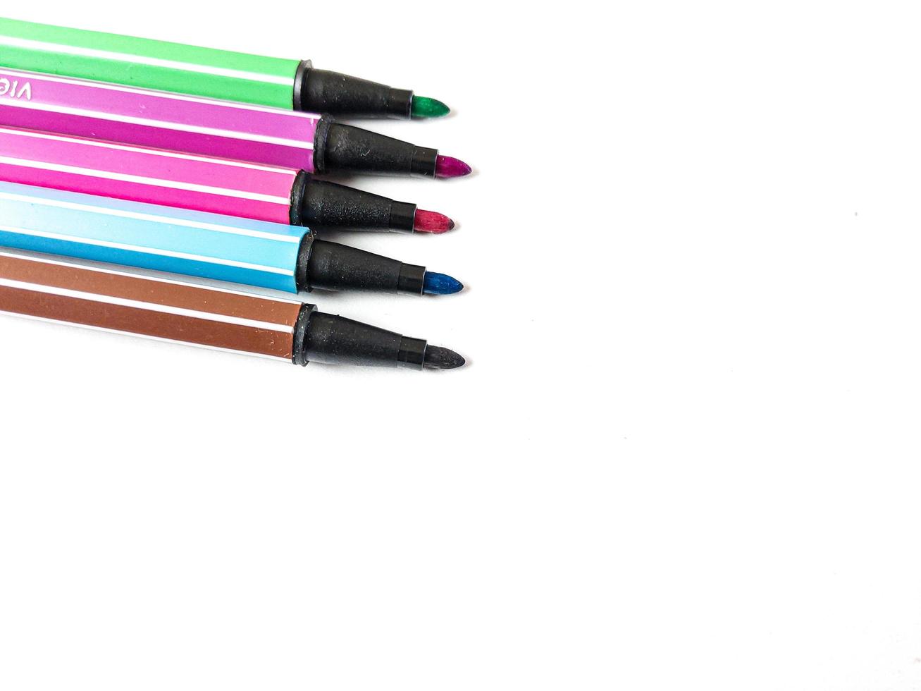 colorful markers isolated on white background photo