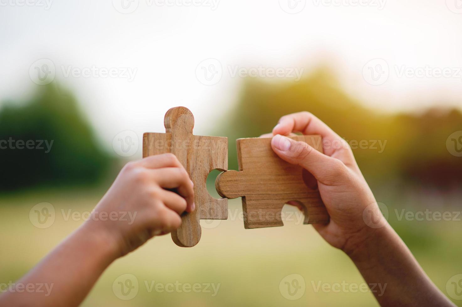 jigsaw and hands Combine the power of unity, teamwork, teamwork. photo