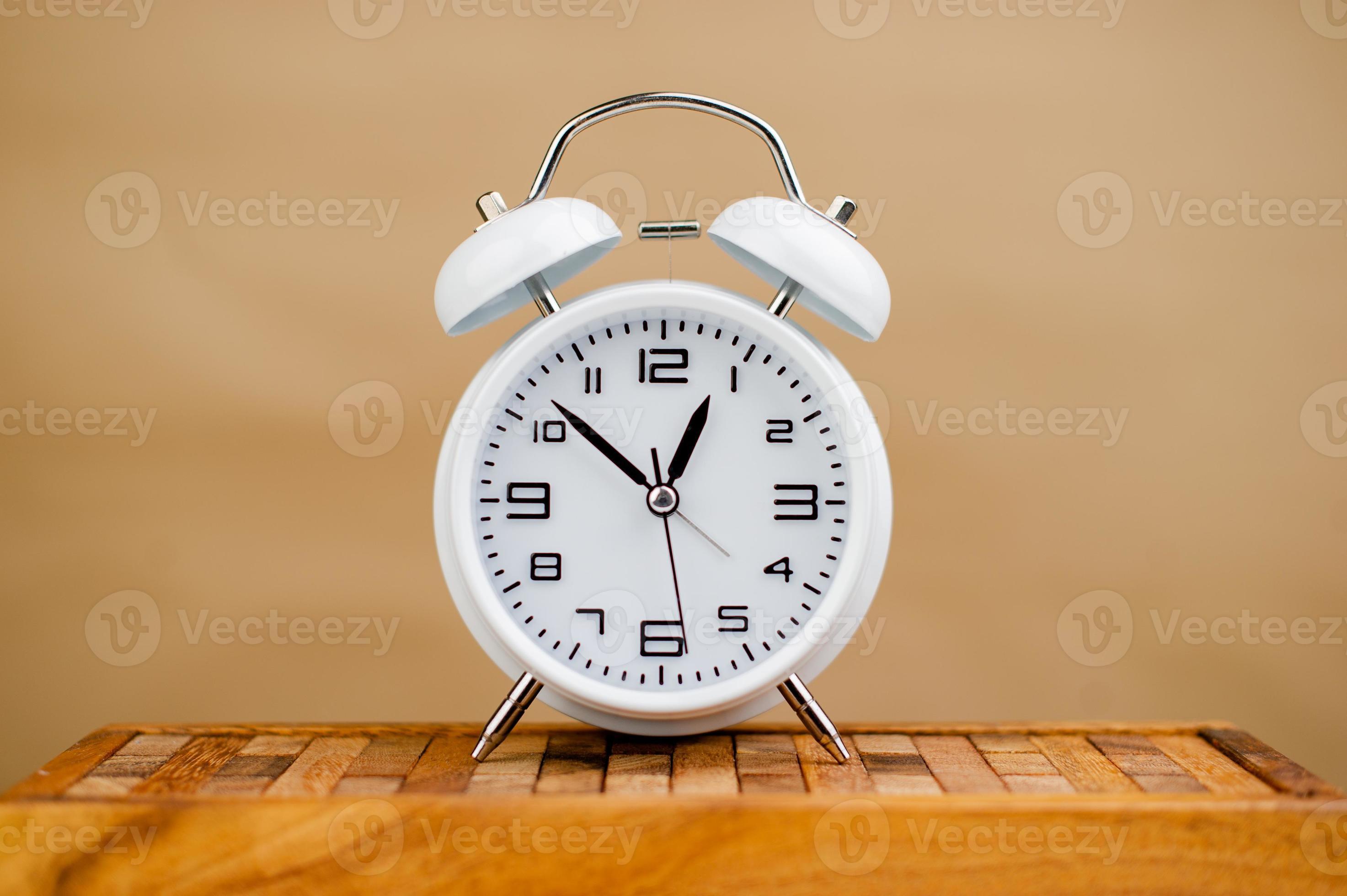 white alarm clock stop watch photo 19935449 Stock Photo at Vecteezy