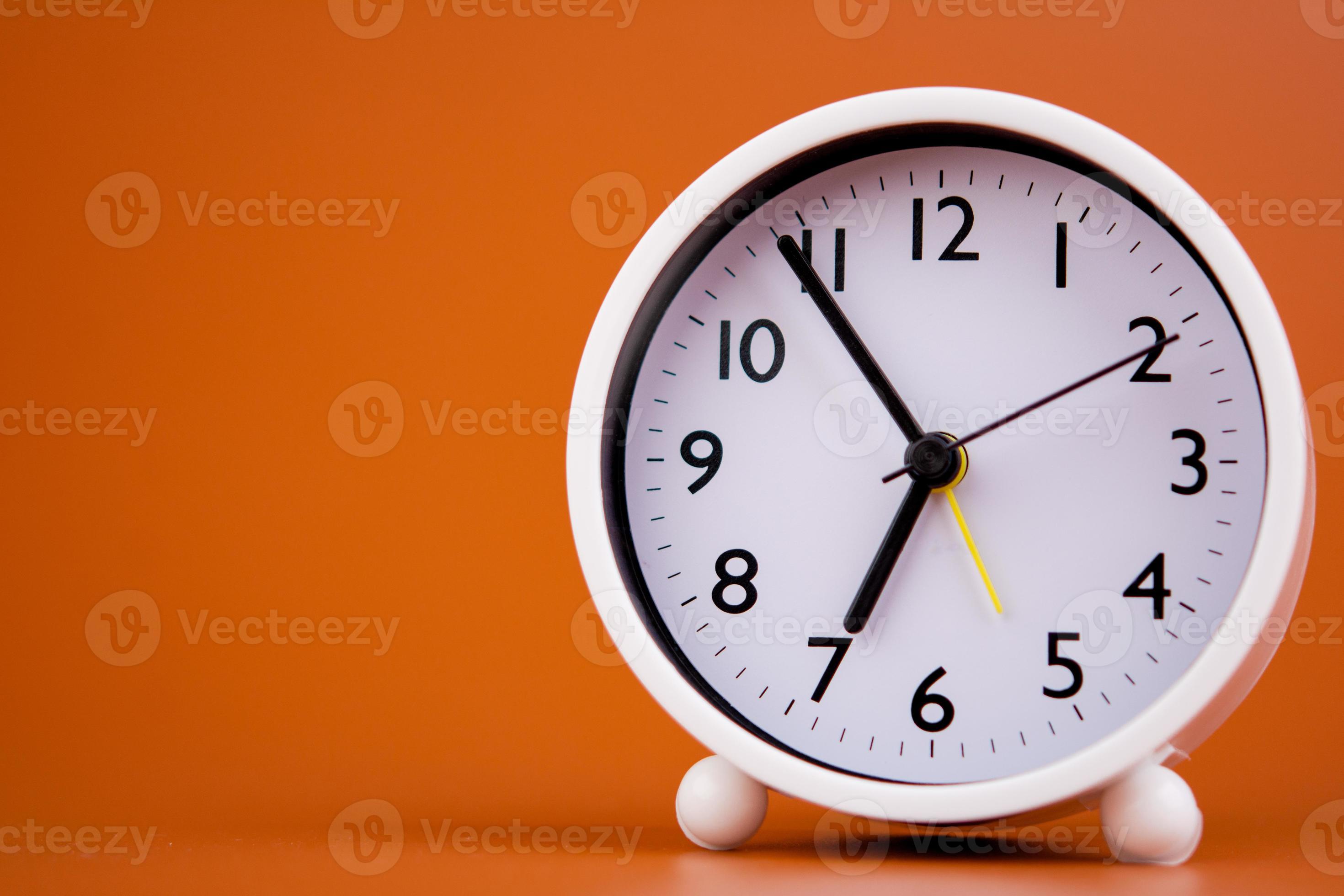 white alarm clock stop watch photo 19935454 Stock Photo at Vecteezy