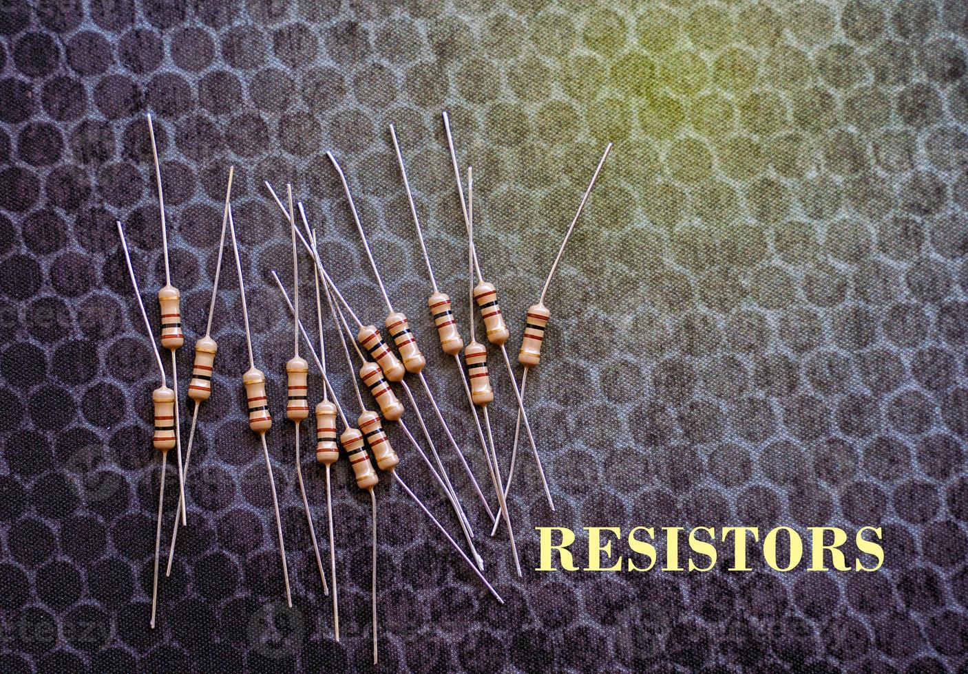 Resistors are electronic devices that control the amount of current and voltage between two points in a circuit. Soft and selective focus. photo