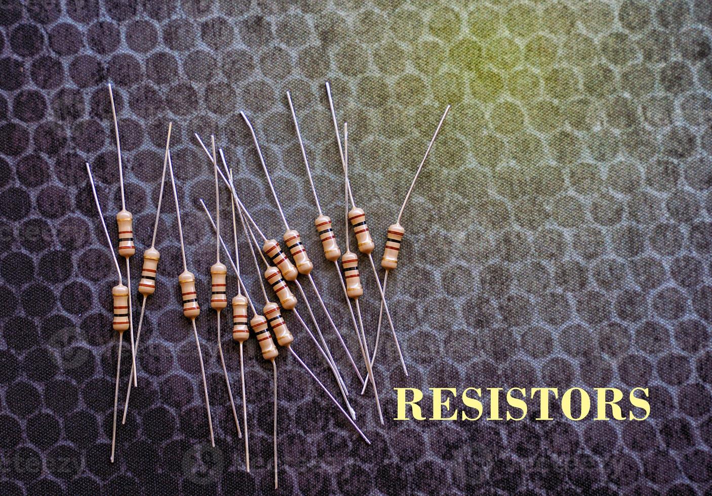 Resistors are electronic devices that control the amount of current and voltage between two points in a circuit. Soft and selective focus. photo