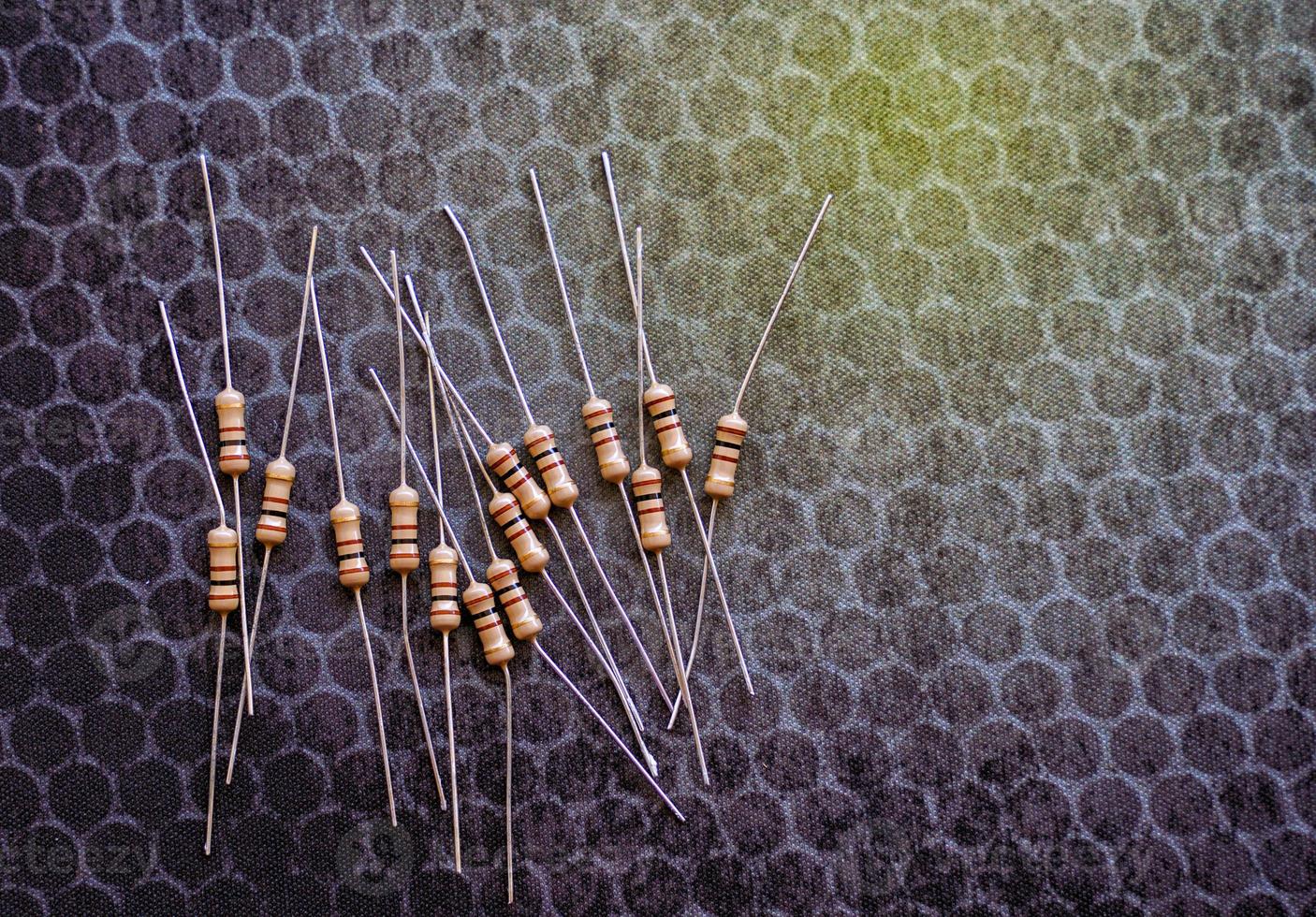 Resistors are electronic devices that control the amount of current and voltage between two points in a circuit. Soft and selective focus. photo