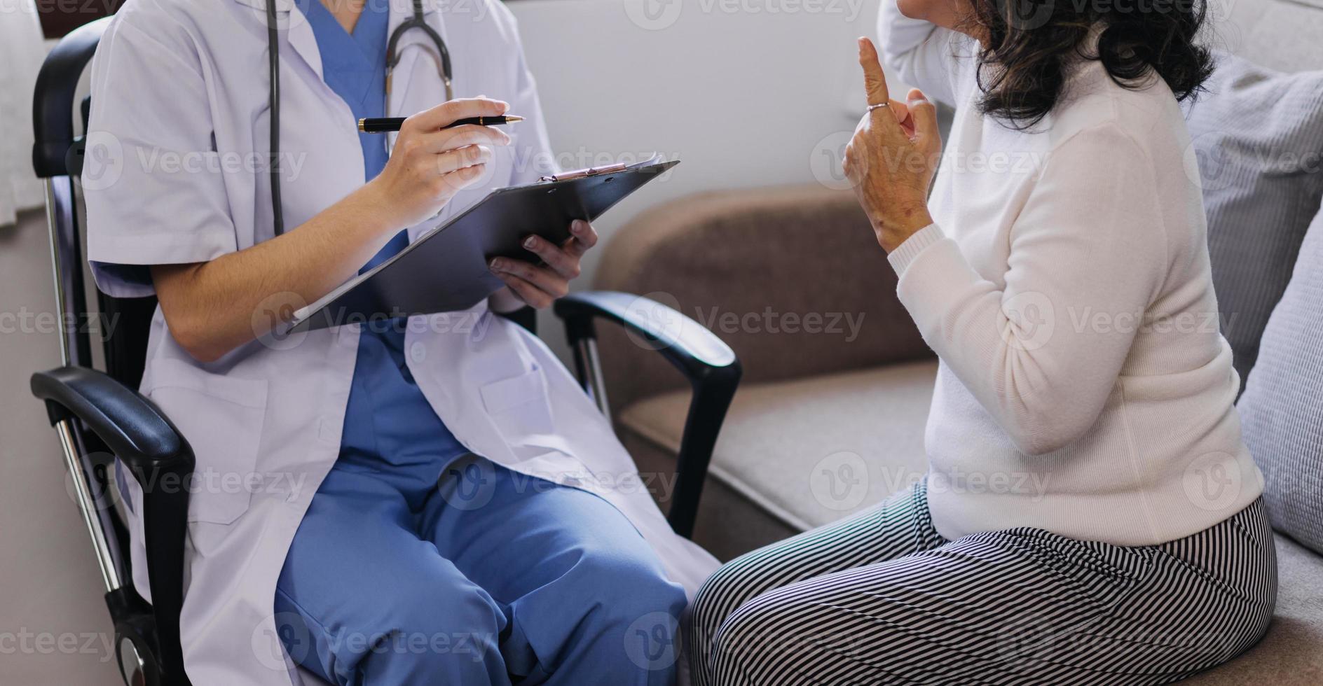 Homecare nursing service and elderly people cardiology healthcare. Close up of young hispanic female doctor nurse check mature caucasian man patient heartbeat using stethoscope during visit photo