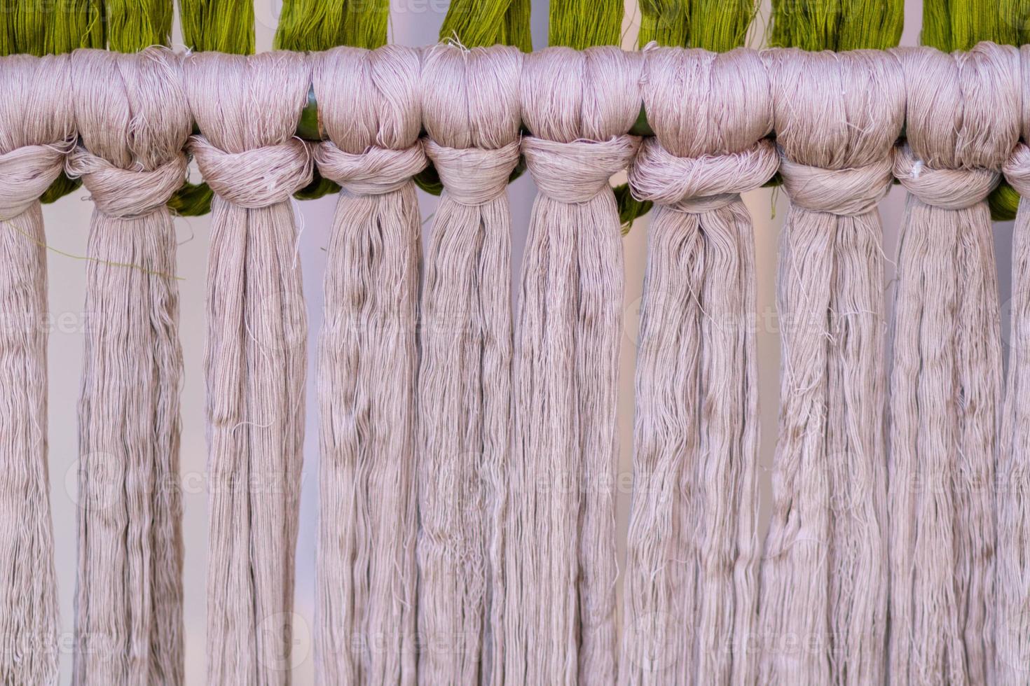 Many of the threads that are dyed brightly are the ones that have been prepared for the traditional loom because the fabric woven on the traditional loom is handmade and expensive. photo