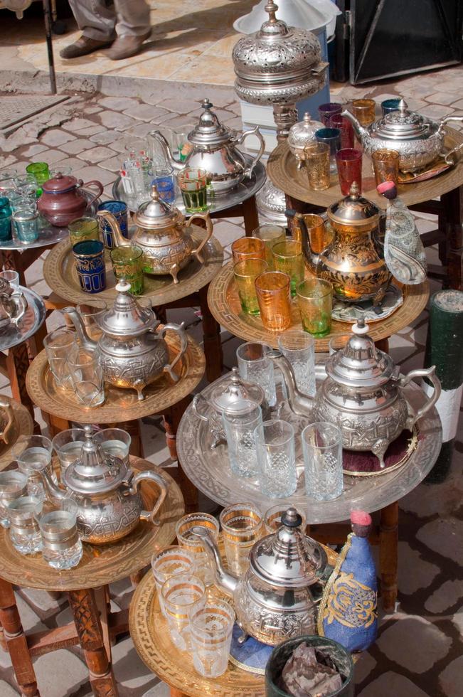 Assorted tea sets to sell in a street market in Morocco photo