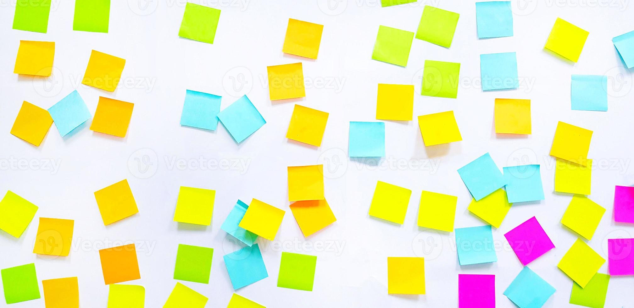 Colorful or multicolor post it isolated on white background. Group of paper sticky on wall to share idea, thinking, knowledge, opinion, message, information, notice and brainstorming for business. photo