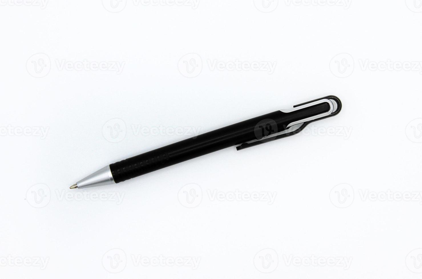 Flat lay of black modern pen or mechanical pencil isolated on white background. Top view of object for writing photo