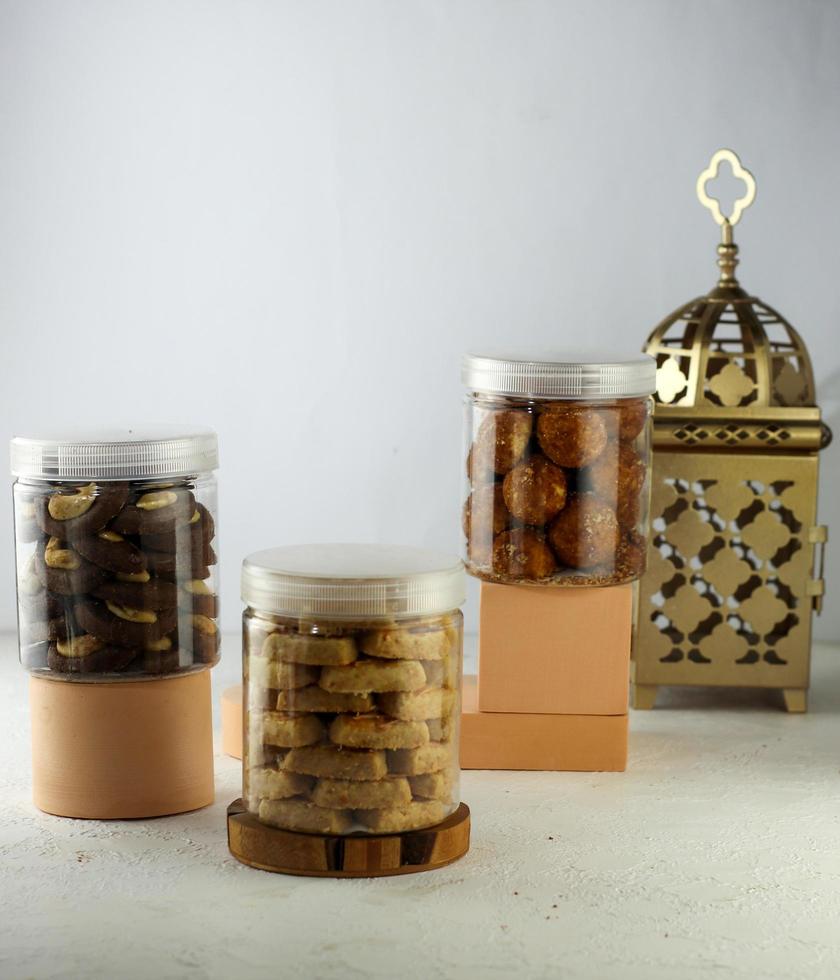 Indonesian famous cake for celebrate Ied Mubarak, famous cookies in a jar with a pink clear background. selective focus photo