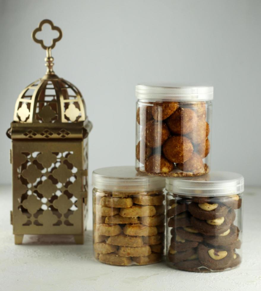 Indonesian famous cake for celebrate Ied Mubarak, famous cookies in a jar with a pink clear background. selective focus photo