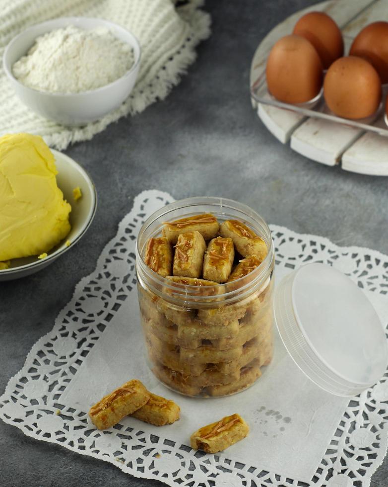 Kastengel or kue keju Indonesian cheese cookie in the form of sticks. popular cookies during festive occasion like idl fitr photo