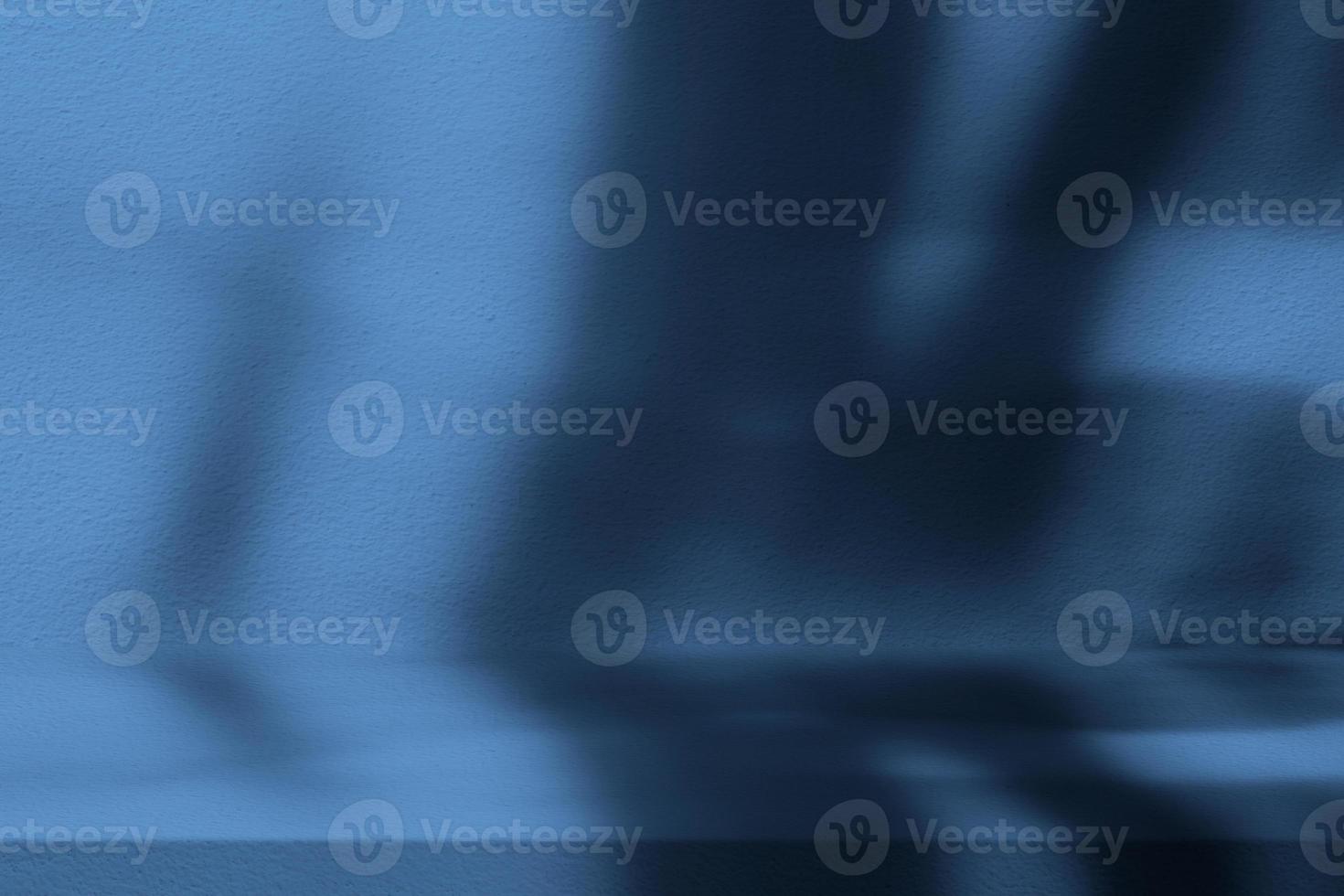 French Blue Stucco Table with Nature Shadow on Concrete Wall Texture Background, Suitable for Cosmetic Product Presentation Backdrop, Display, and Mock up. photo