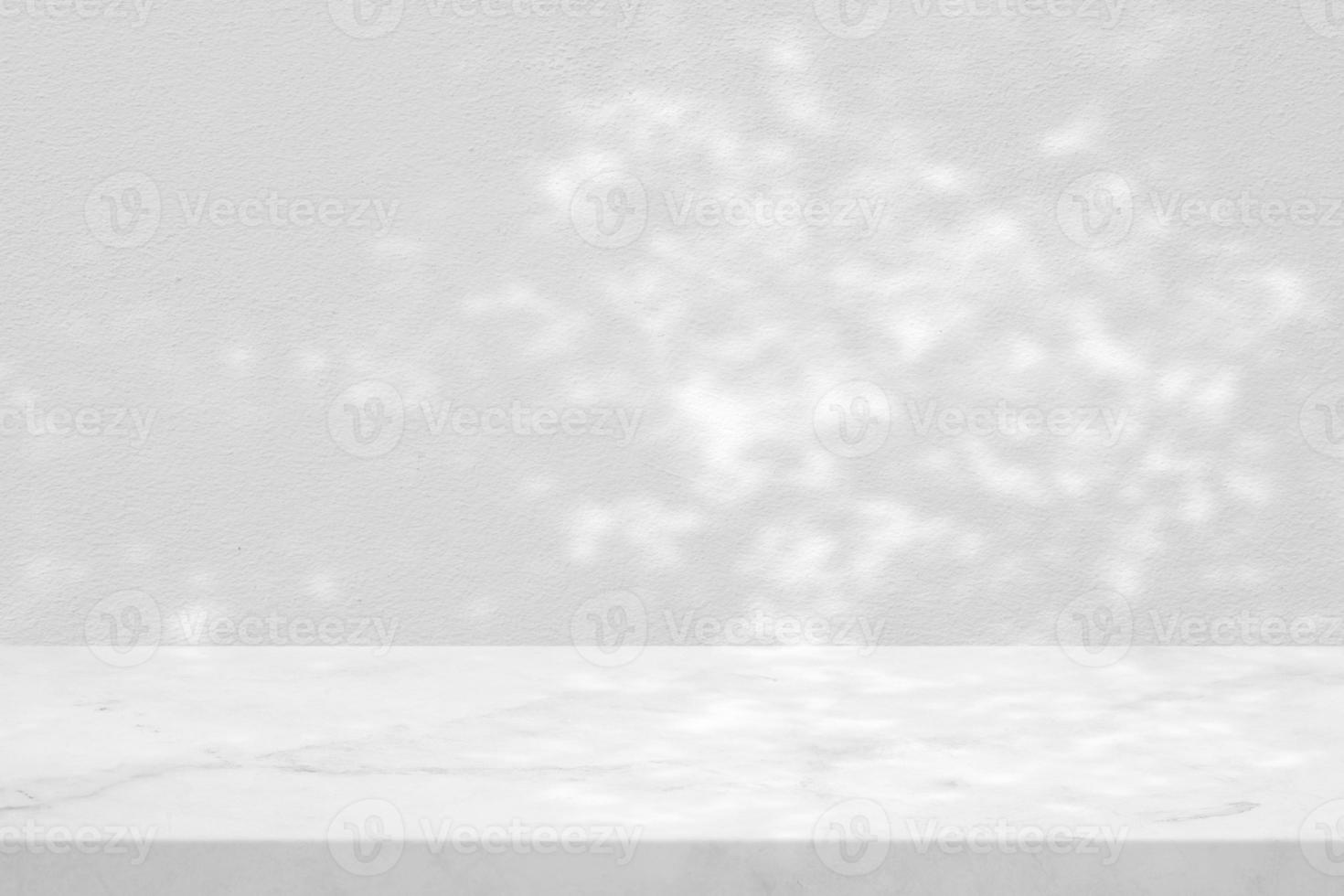 White Marble Table with Tree Shadow on Concrete Wall Texture Background, Suitable for Product Presentation Backdrop, Display, and Mock up. photo