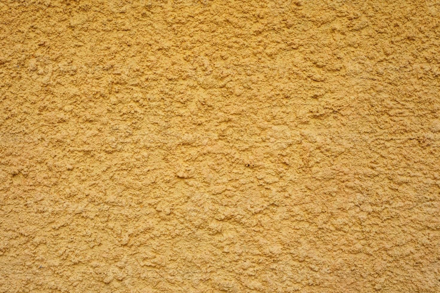 Yellow Stucco Wall Texture Background. photo