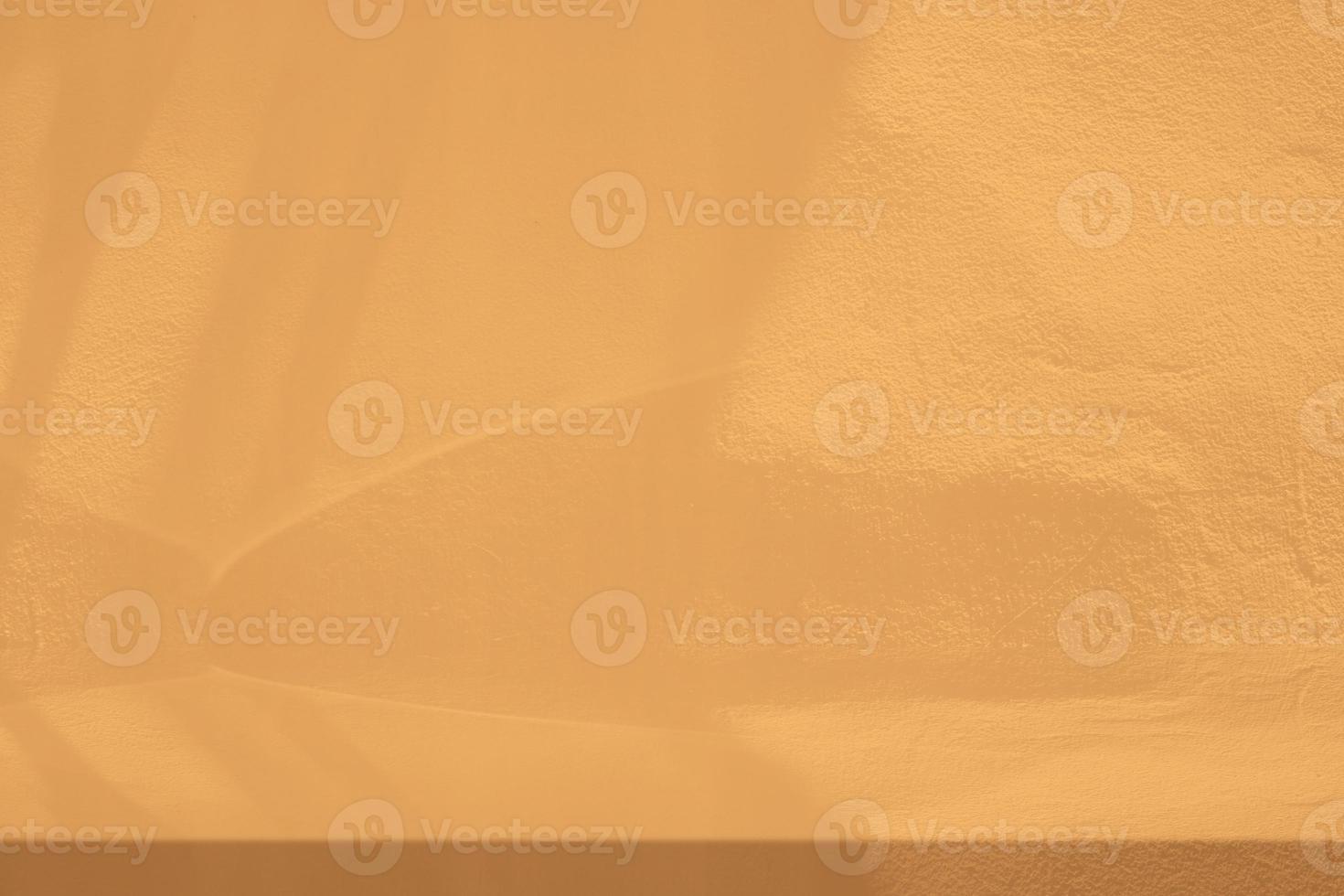 Gold Stucco Table with Nature Shadow on Concrete Wall Texture Background, Suitable for Cosmetic Product Presentation Backdrop, Display, and Mock up. photo