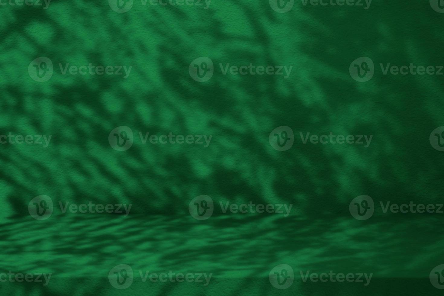 Quiet Wave Green Color Stucco Table with Nature Shadow on Concrete Wall Texture Background, Suitable for Cosmetic Product Presentation Backdrop, Display, and Mock up. photo