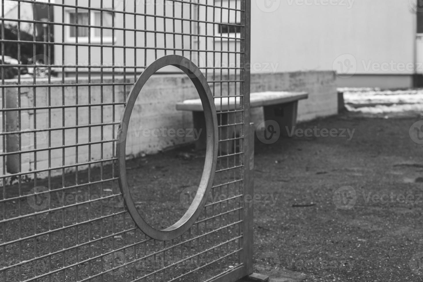 a metal soccer goal in a city photo