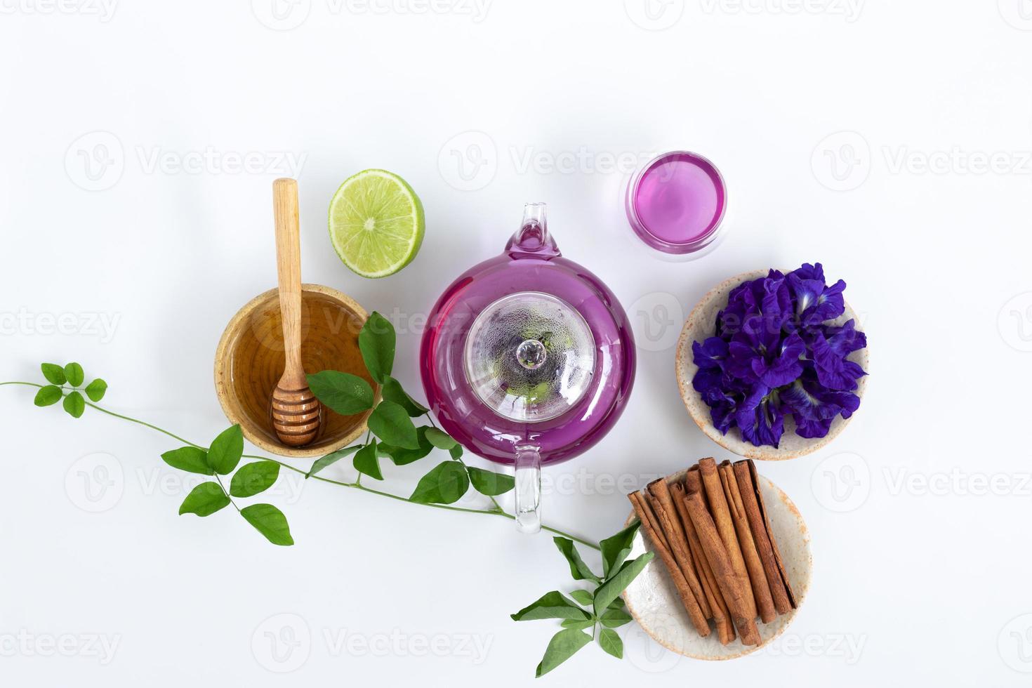 Top view of Butterfly pea flower tea with lemons on white background. Health drink concept photo