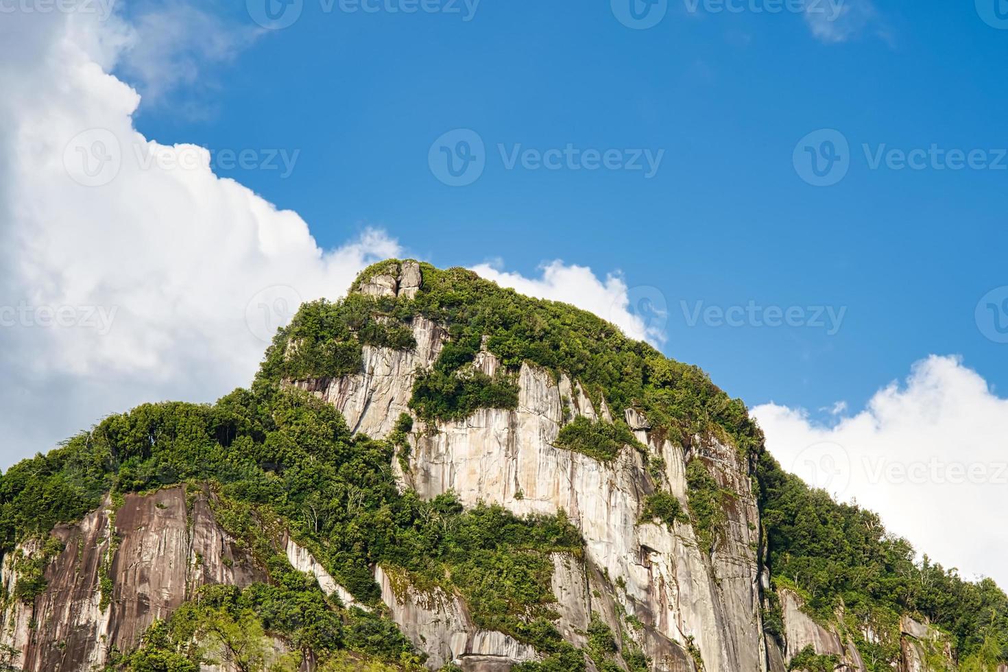 Morn blanc mountain, a hiking trail on Mahe island, beautiful granite rock and vegetation photo