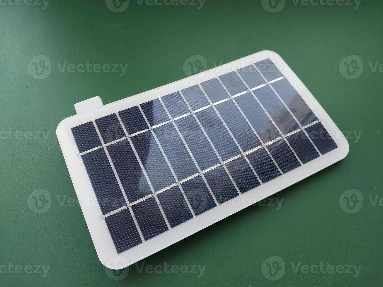 Solar battery to charge smartphone and power bank photo