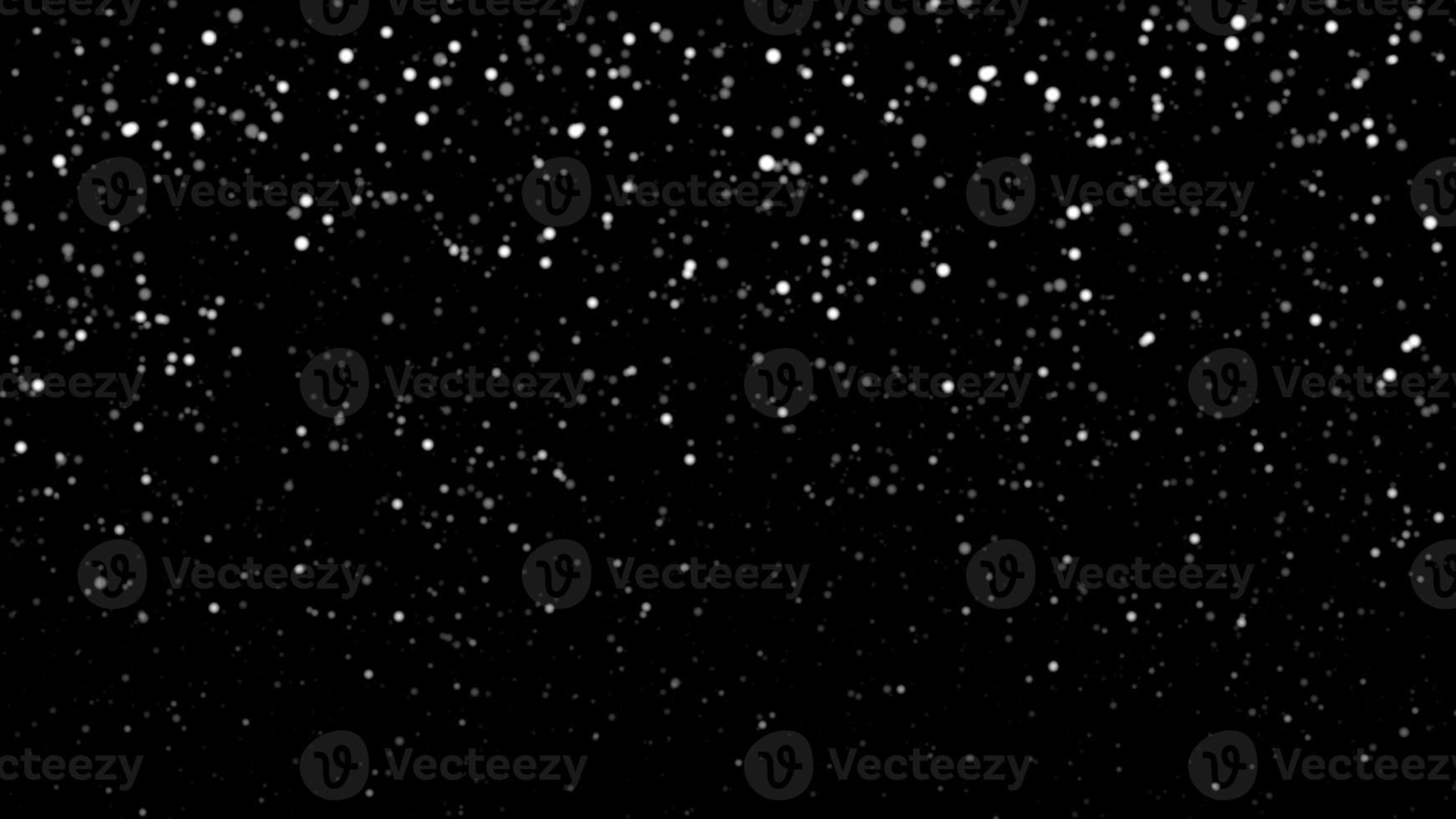 Snowfall bokeh on black background. Many snowflakes in flying in the air. Winte night snowfall and blizzard of snow at. Blur bokeh light effect creative background. photo