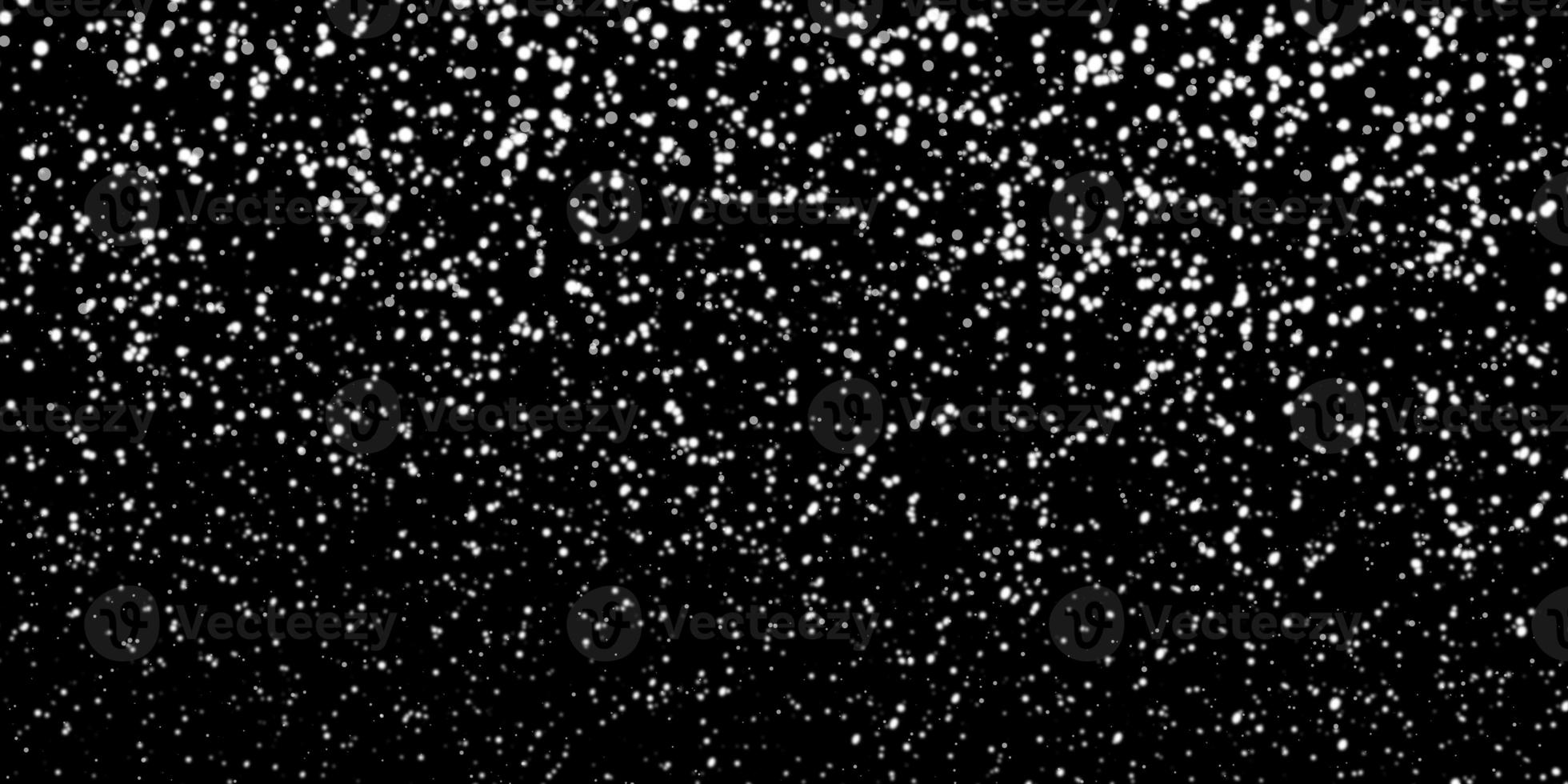 Snowfall bokeh on black background. Many snowflakes in flying in the air. Winte night snowfall and blizzard of snow at. Blur bokeh light effect creative background photo