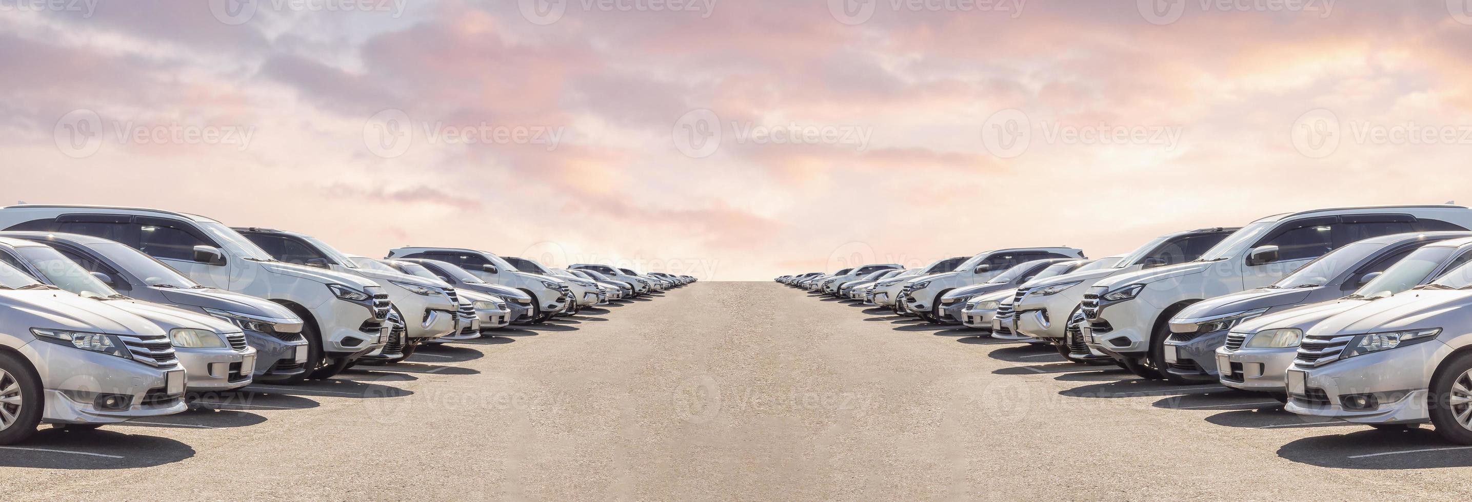 Lot of used car for sales in stock with sky and clouds photo