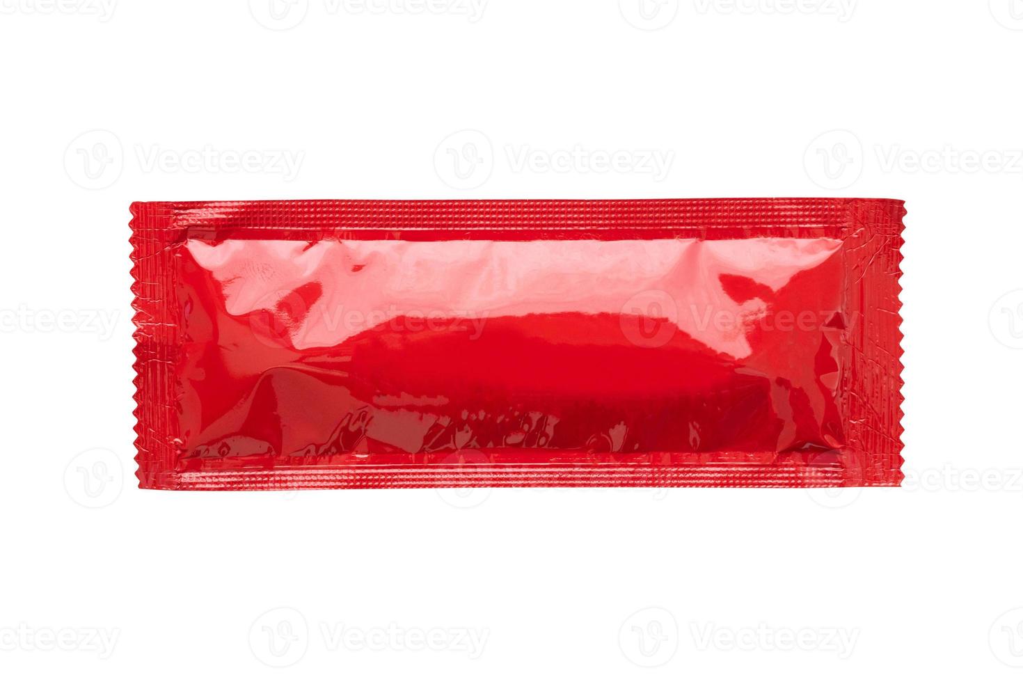 Blank red foil tomato ketchup sauce sachet package isolated on white background photo