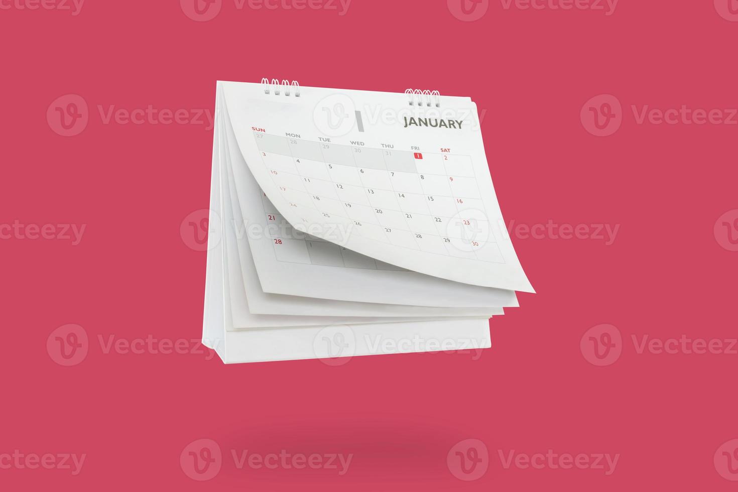 White paper desk calendar flipping page mockup isolated on red background photo