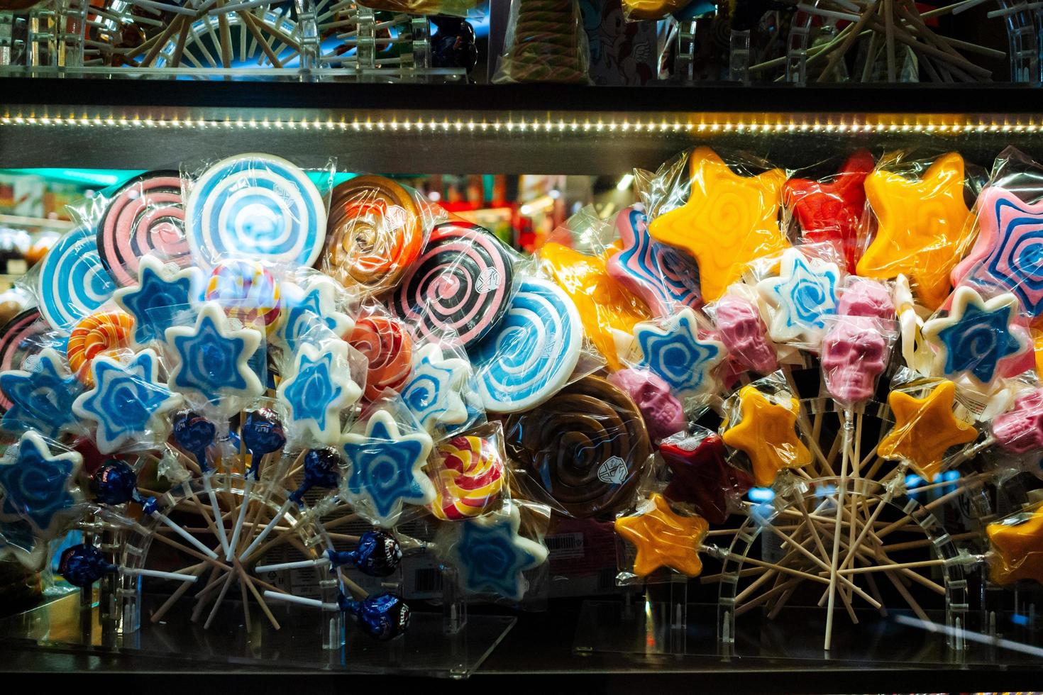 MOSCOW, RUSSIA-FEBRUARY 1, 2020 Different lollipops on showcase at candy shop, closeup photo