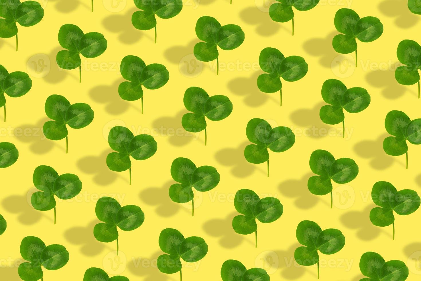 Clover leaf pattern on colored background. Abstract background for St. Patrick's Day photo