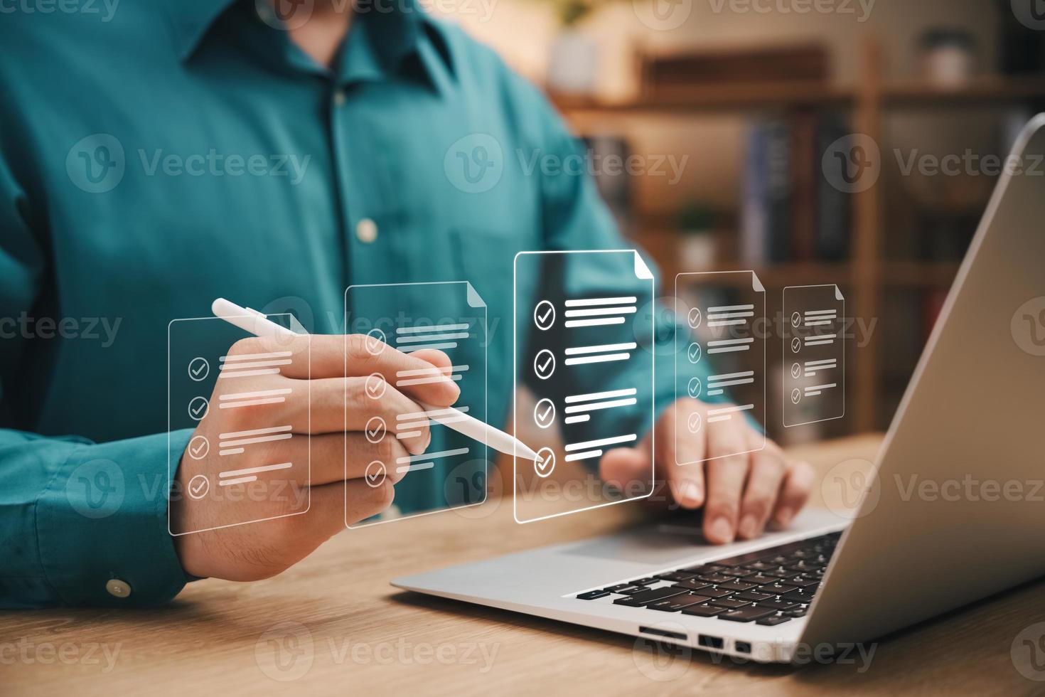 Quick checklist and clipboard management concept, businessman working checklist questionnaire assessment form, checking laptop performance and filling out online survey, efficient management. photo