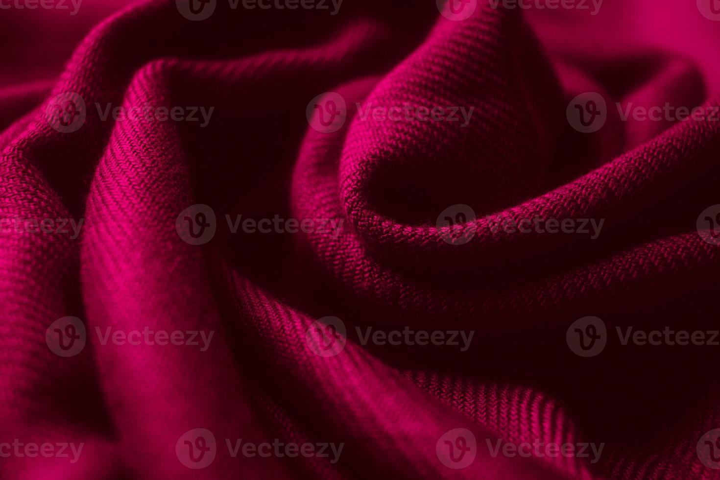 Fabric texture background of magenta color Viva Magenta. Close up of