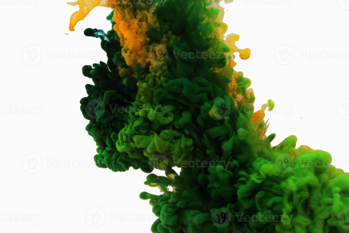 abstract background colour in water yellow green blue on white background in water with a white background. like abstract-style smoke paintings photo
