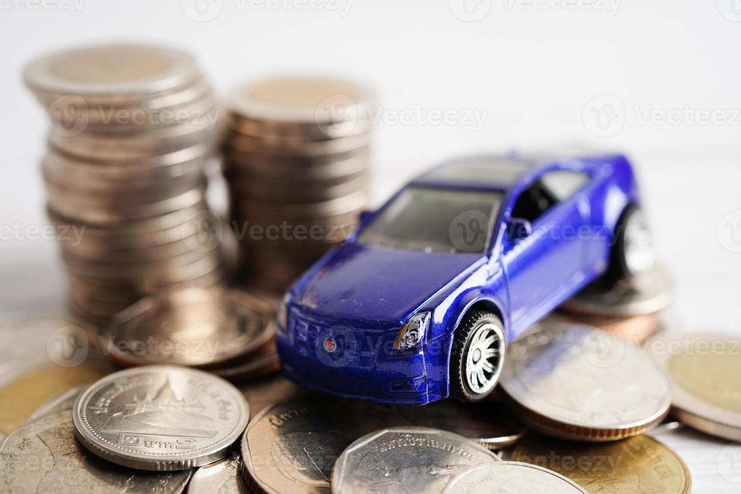 Bangkok, Thailand January 20, 2022 Car on coins money, saving bank, finance, installment payment, car loan interest. photo