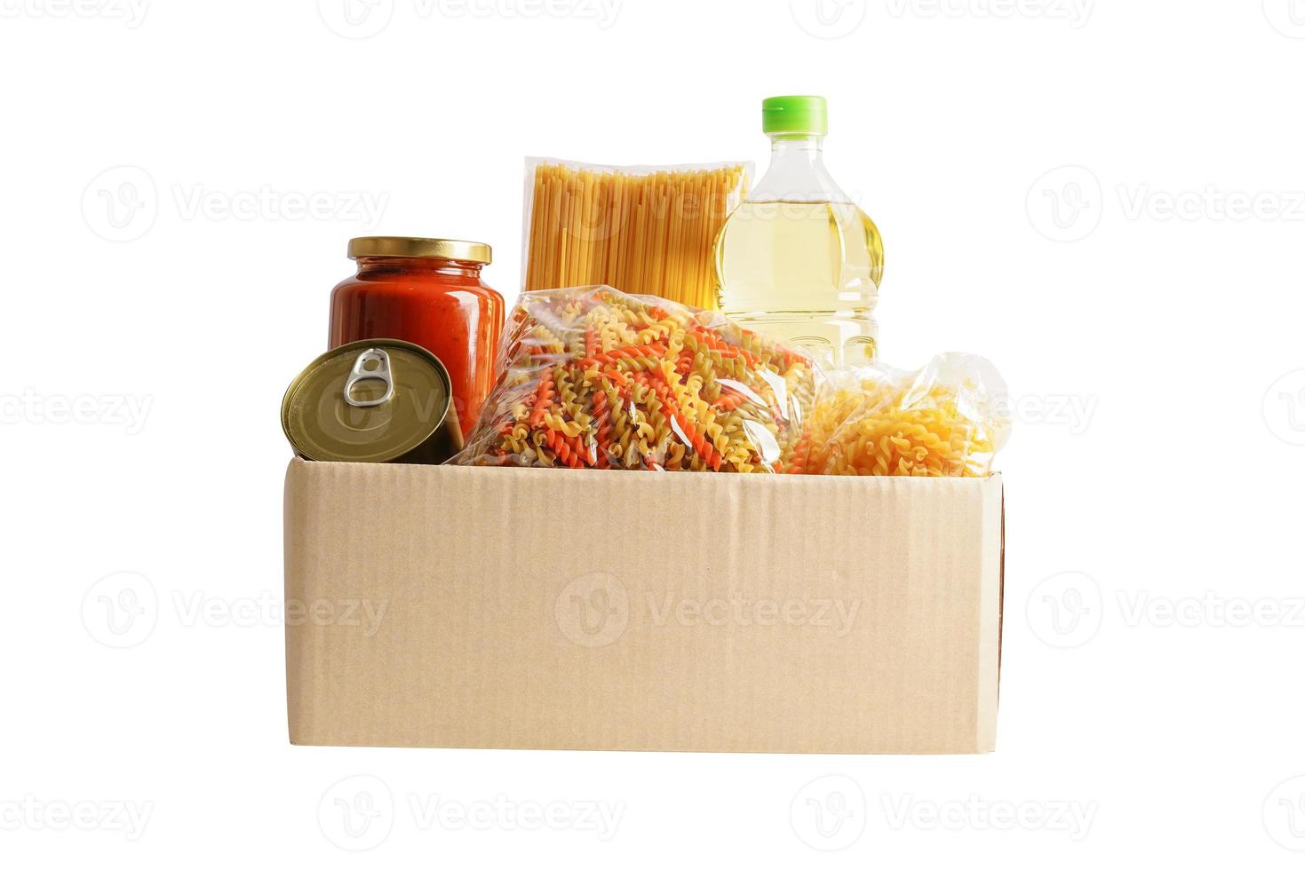 Foodstuffs in donation box isolated on white background with clipping path for volunteer to help people. photo