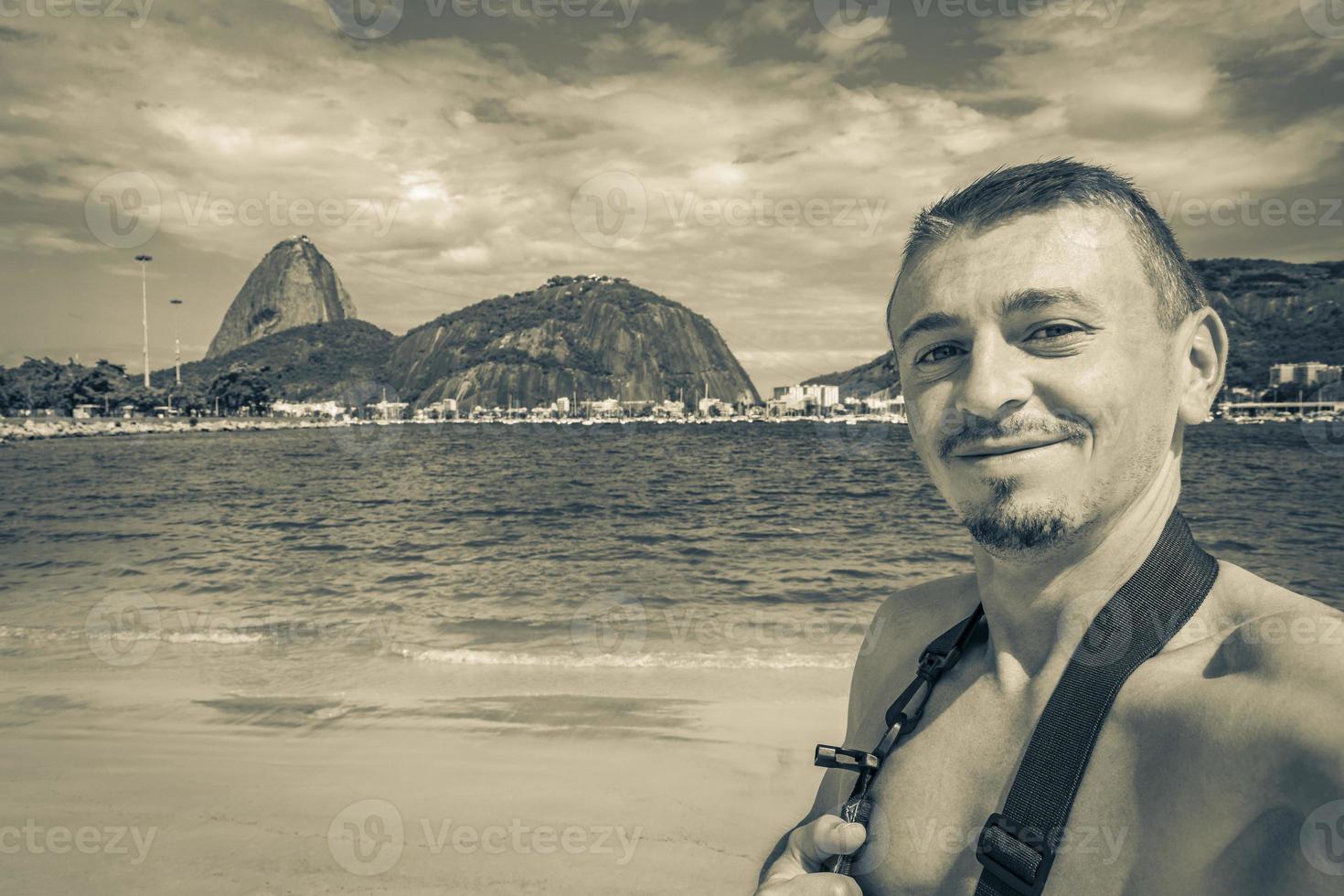 Tourist traveler takes selfie Sugarloaf mountain Rio de Janeiro Brazil. photo