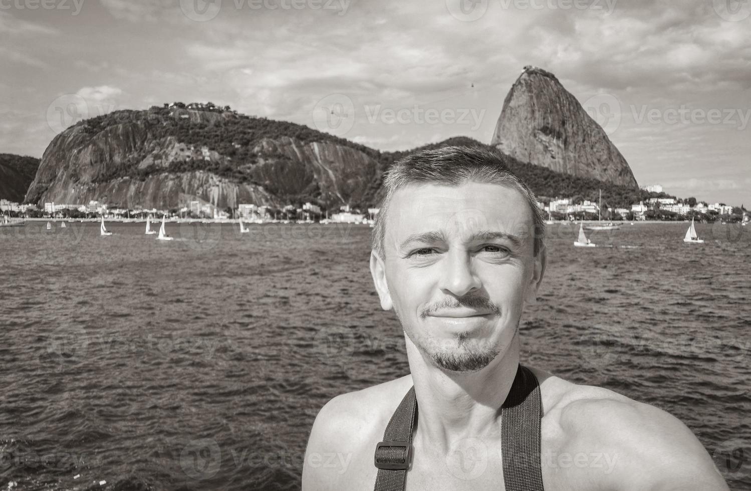 Tourist traveler takes selfie Sugarloaf mountain Rio de Janeiro Brazil. photo