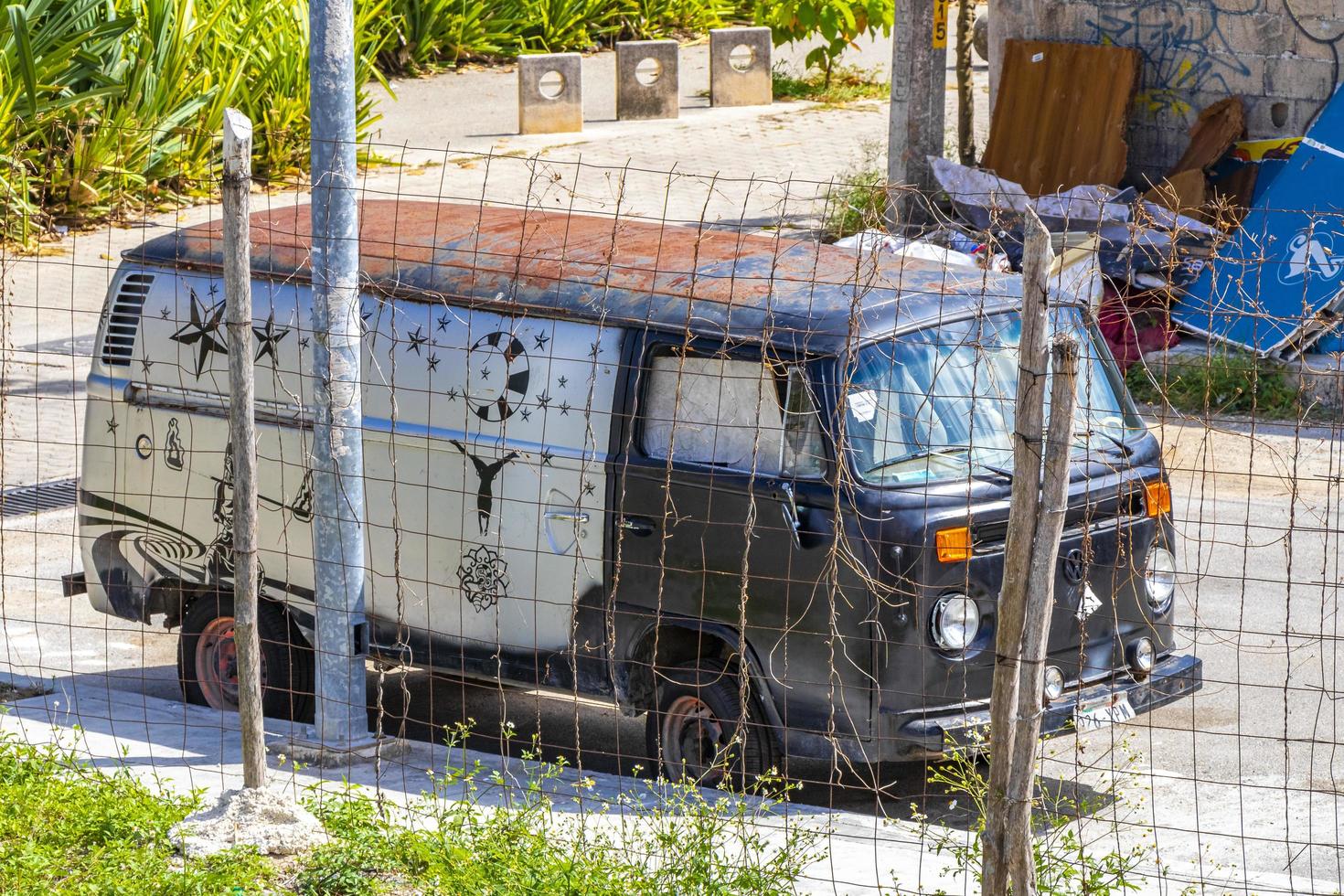 Playa del Carmen Quintana Roo Mexico 2021 Old black broken dirty VW bus Volkswagen car rusting Mexico. photo